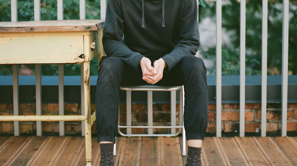 Put both feet flat on the ground and keep your legs uncrossed.